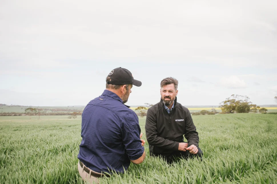 Farmer and Viterra rep in field