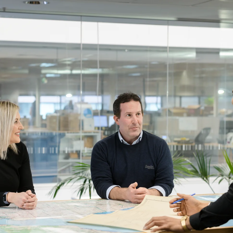 Colleagues chatting in office setting