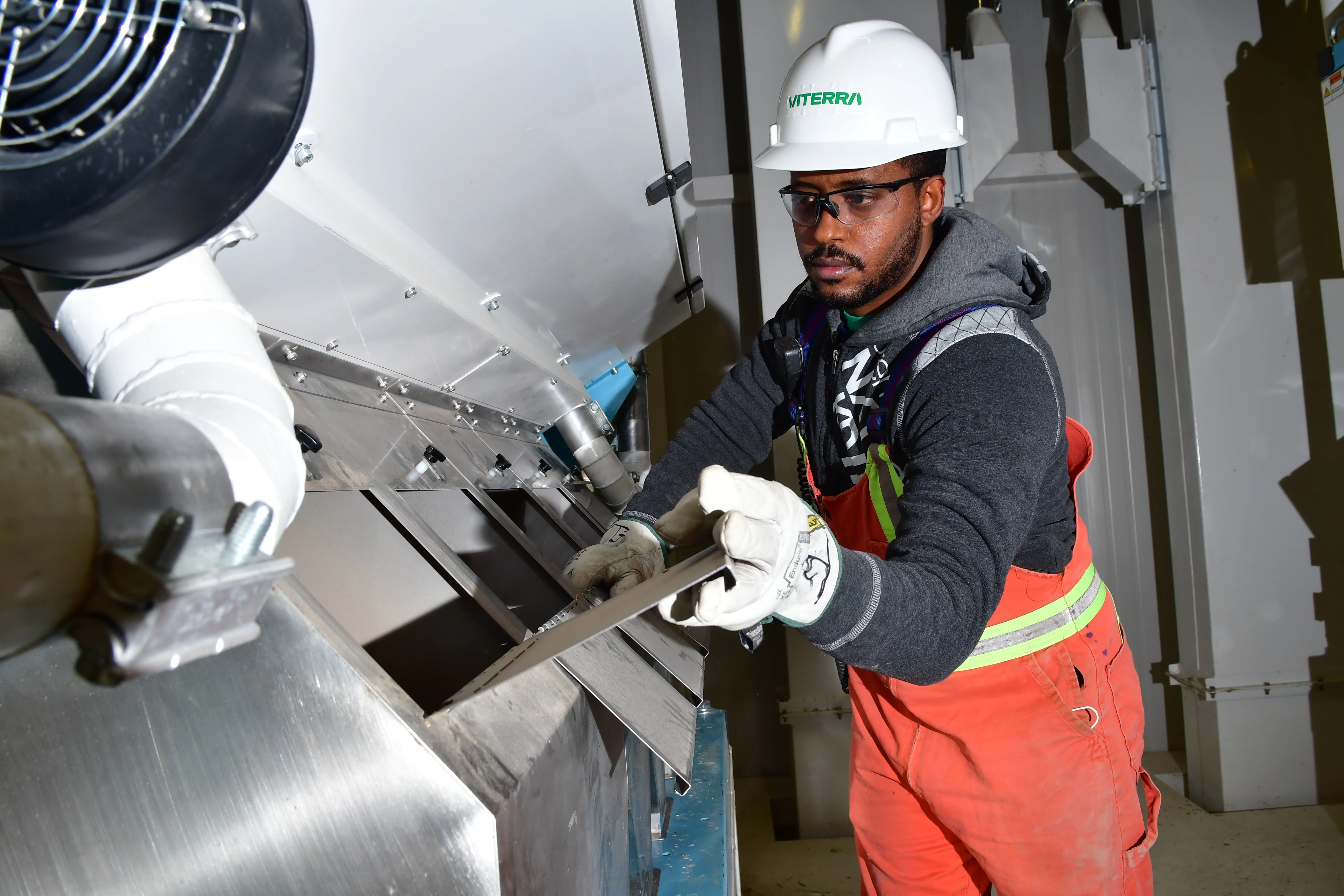 Employee bagging product at Belle Plaine processing facility