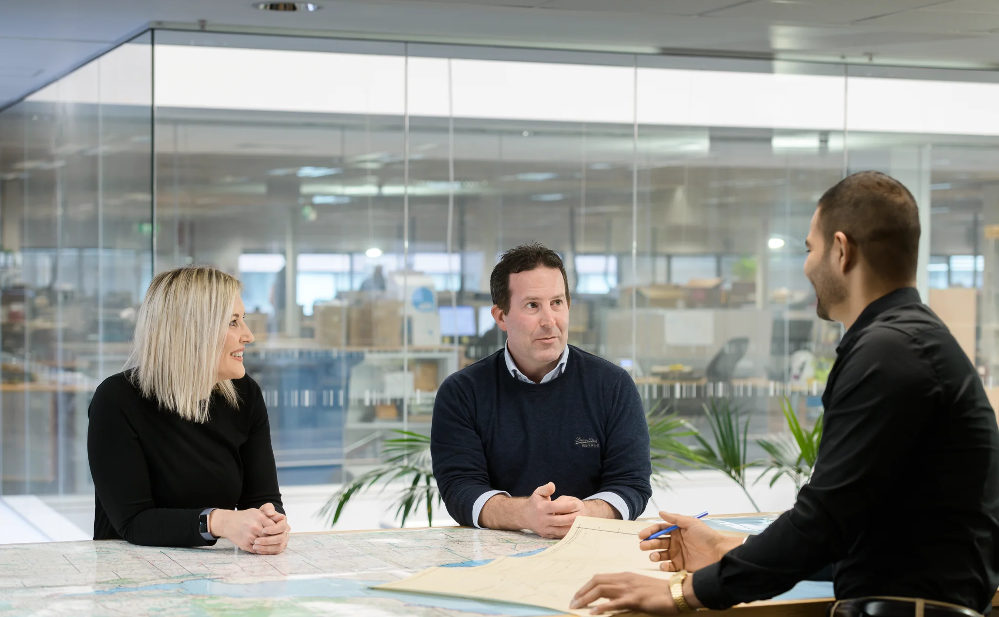 Colleagues chatting in office setting